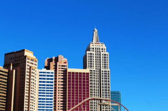High rise condos with a blue sky in background